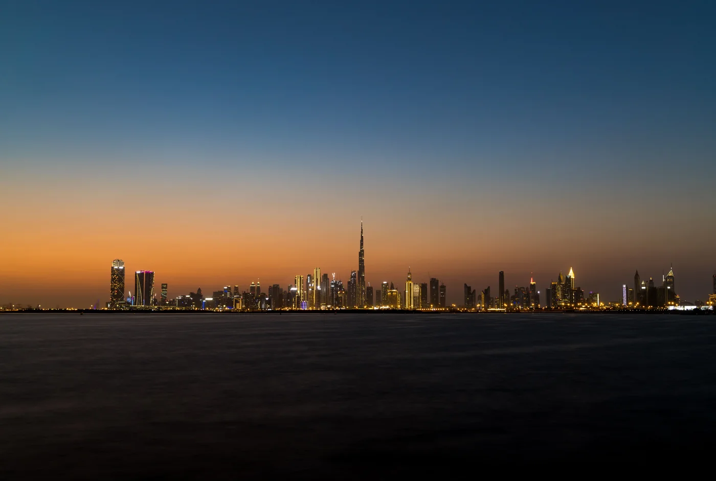 Dubai, across the sea at dusk